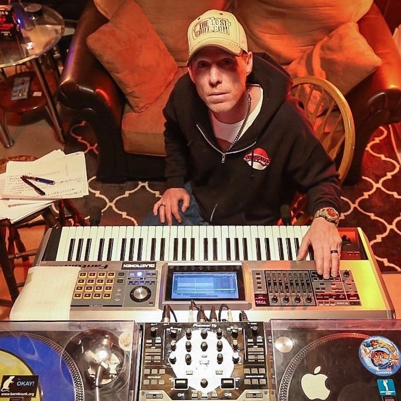 DJ Natural Nate® at the production setup with keyboard and turntables